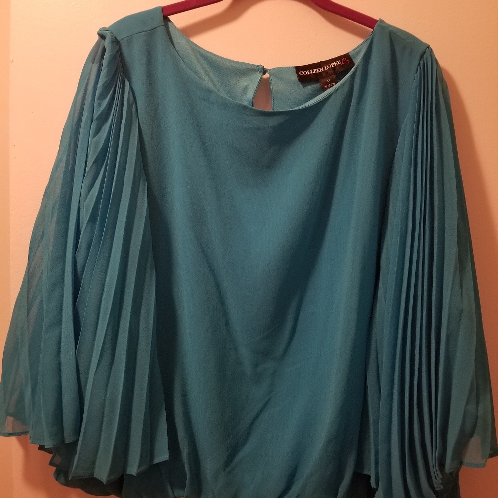 Shirt color is teal